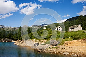 Small houses on Devero lake photo