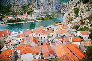 Small houses and river Cetina in town Omis