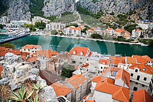 Small houses and river Cetina in town Omis