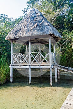 Small hut bulit on Laguna Lachua lake, Guatema photo