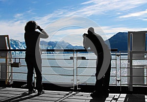 Cruise Ship Passengers watch glacier icebergs photo