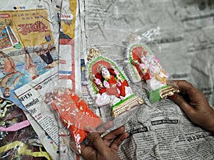 Small idols of hindu god and goddess. Laxmi puja during festival of diwali.