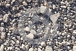 Small irregular-shaped gravel stones texture background