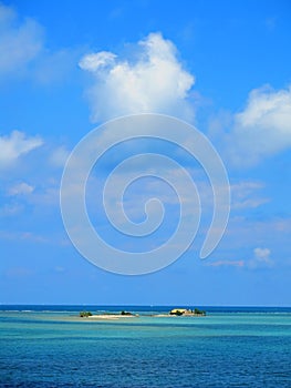 Small island in blue sea