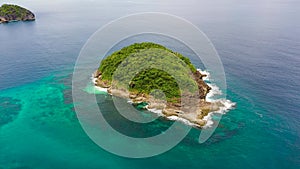 A small island covered in the jungle. Caramoan Islands, Camarines Sur, Philippines.