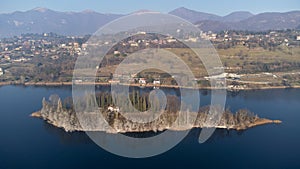 Small island of cypresses in Lake Pusiano