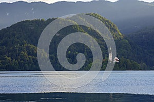 The small island of Lake Bled with high mountains, Slovenia