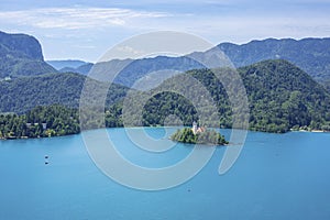 The small island of Lake Bled, Slovenia in the distance