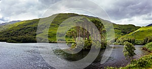 Small island on Loch Eilt - Place where was Dumbledore`s grave in The Harry Potter Movie, located near Glenfinnan Viaduct photo