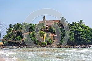 A small island near the beach by the ocean