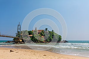 A small island near the beach by the ocean