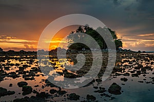 Small island by the sea with the beautiful colorful sunset in Phuket