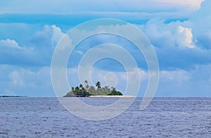 Small island in tropical sea Maldives atoll