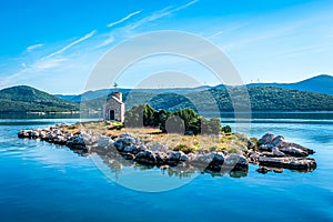 Small island with a very old lighthouse