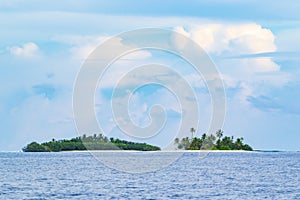 Small islands in tropical sea Maldives atoll