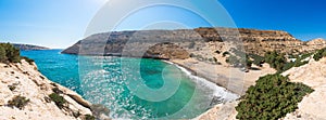 The small isolated gulf of Vathi, in Crete, with sandy beach and some lucky campers.