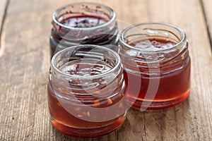 Small jam jar on wood table