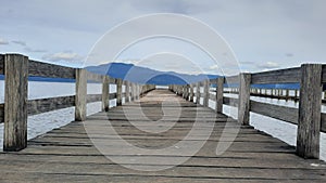 small jetty on lindu lake lore lindu national park, central sulawesi photo