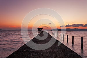 Small jetty in to the sea in Long exposure image of dramatic sunset or sunrise,sky and clouds over tropical sea scenery landscape