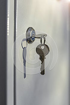 A small key stuck in the door lock