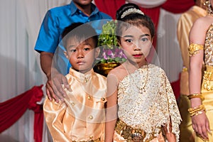 Small Khmer kids posing to photography in traditional wedding outfit