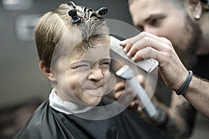 Small kid in barbershop