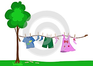 Small kid clothes drying on a rope
