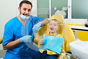 Small kid, patient visiting specialist in dental clinic