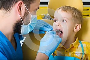 Small kid, patient visiting specialist in dental clinic