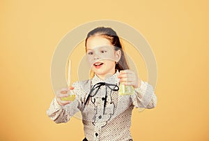 Small kid study. Chemistry lesson. Insight and invention. Educative experiment. Chemistry fun. Schoolgirl with colorful photo