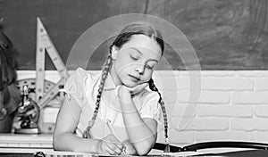 Small kid study school. Knowledge day. Hometask concept. Back to school on first of september. Hooked on learning