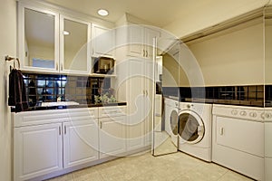 Small kitchen room with built-in laundry area.