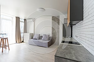 Small kitchenette in a studio, interior lighting.