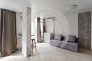 Small kitchenette in a studio, interior lighting.