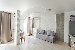 Small kitchenette in a studio, interior lighting.