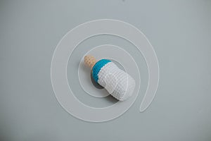 small knitted white and blue baby bottle, pacifier