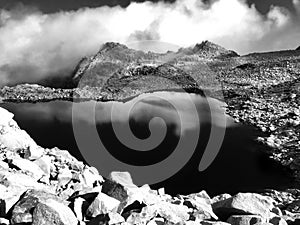 Small lake on the top of the mountains black and white