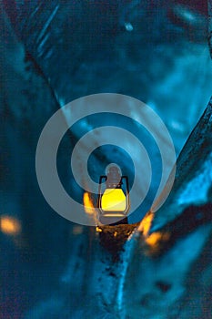 Small lamp into blue natural ice. photo