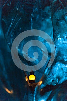 Small lamp into blue natural ice. photo