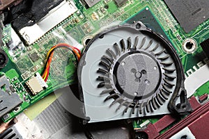 Small laptop computer fan and circuit board.