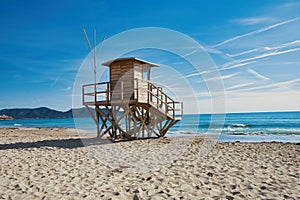 Small lifeguard tower against a cloudless, bright blue sky, Mallorca, Cala Millor Beach