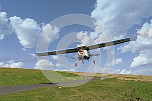 Small light aircraft taking off a mountain road in south wales