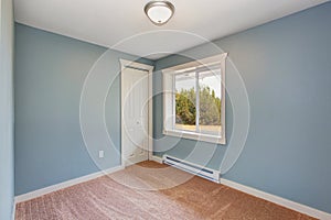 Small light blue bedroom in empty house