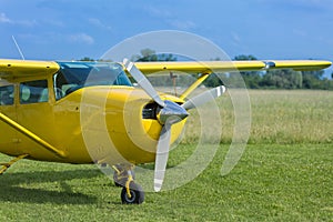 Small and Light Yellow Piper Aircraft near to the Runaway Ready to Take Off