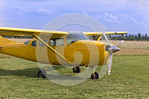 Small and Light Yellow Piper Aircraft near to the Runaway Ready to Take Off