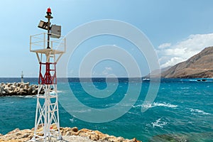 Small lighthouse at port of Chora Sfakion town on Crete island, Greece