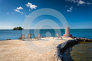 Small lighthouse and rocky beach in Marathon, Florida.