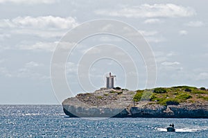 Small lighthouse on a rocky shore