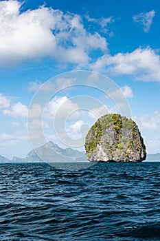 Small limestone sphere like island in El nido region of Palawan archipelago in the Philippines