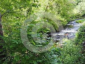 the small local river of mandeo as it passes through the village of vilasantar, la coruÃ±a, galicia, spain, europe